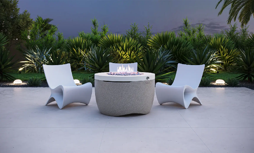 Modern sculptural outdoor lounge chairs surrounding a fire pit for stylish commercial pool deck and hospitality seating areas.